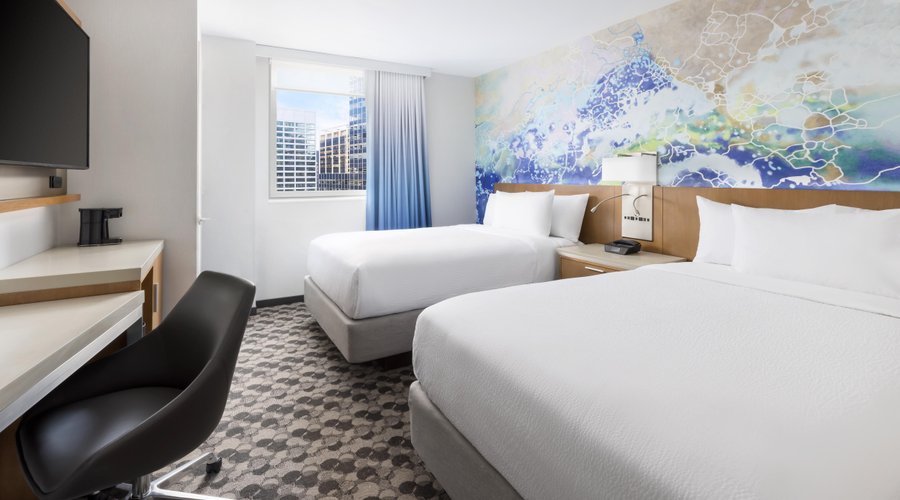 Our contemporary and refreshing 2 double bedded rooms feature 2 luxurious beds, a hybrid work/entertainment zone featuring a mini refrigerator, complimentary WiFi, complimentary in room coffee maker, and multiple plugs and USB ports for your charging needs. 