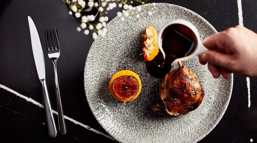 Duck leg confit served with cheese dumplings, Jerusalem artichoke mousse and plum sauce
