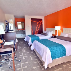 Two Full Bed Room with desk, refrigerator, microwave, and safe