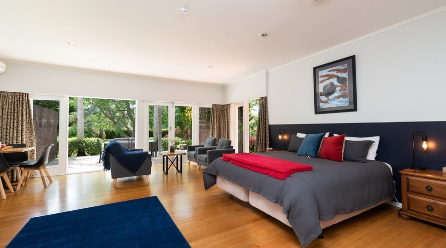 The Takahe suite has a super-king bed which can be converted to two singles if you prefer. The large ensuite bathroom has a full-size bath and a separate shower. You will have a private, sunny patio equipped with a table and chairs, and easy access to the gardens and outdoor swimming pool.