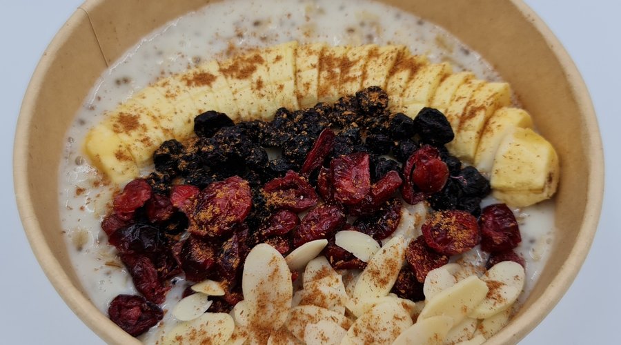 Oatmeal with Banana, Dried Cranberries, Dried Blueberries and Shaved/Blanched Almonds drizzled with Cinnamon Sugar.