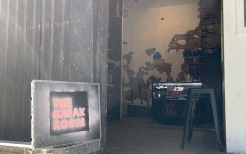 The Break Room entrance is in the alleyway on 29 Budd street.