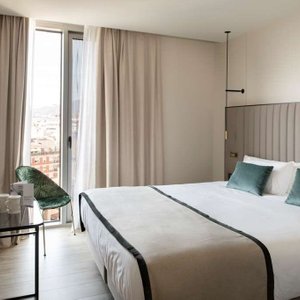 Occidental Barcelona 1929 in Barcelona, image may contain: Interior Design, Home Decor, Chair, Bed
