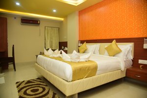 Hotel Bensen in Puri, image may contain: Corner, Home Decor, Bed, Chair