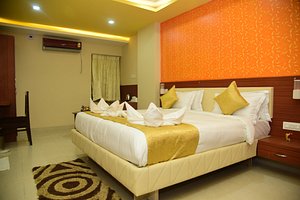 Hotel Bensen in Puri, image may contain: Corner, Home Decor, Bed, Chair