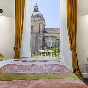 Relais Antica Badia - San Maurizio 1619 in Sicily, image may contain: Linen, Home Decor, Furniture, Bedroom