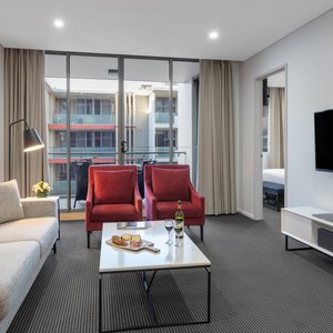 Meriton Suites North Ryde in North Ryde, image may contain: Living Room, Couch, Coffee Table, Table