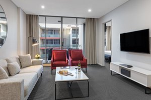 Meriton Suites North Ryde in North Ryde, image may contain: Living Room, Couch, Coffee Table, Table