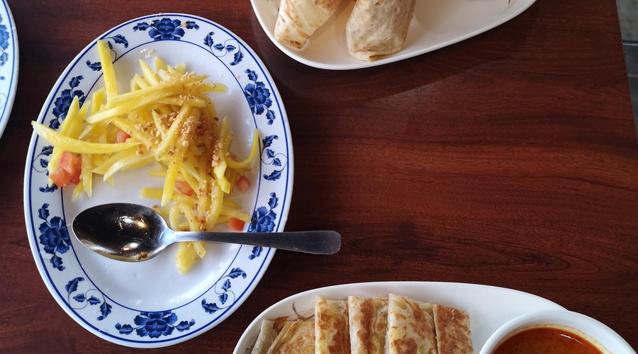 Our excellent lunch.  Roti canai, roti telur, green papaya salad and Kerabu mango salad.