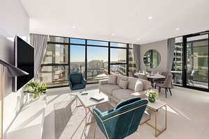 Meriton Suites Sussex Street, Sydney in Sydney, image may contain: Penthouse, Living Room, Table, Couch
