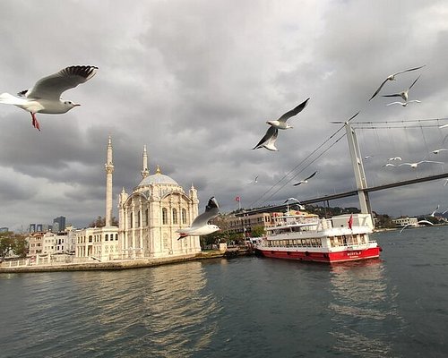 2 Guys talking on a wall waiting to cross the Bosphorus, Istanbul, Turkey