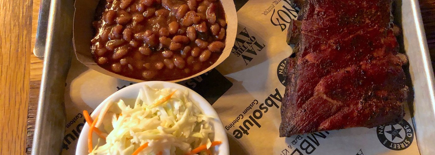 Fabulous pork BBQ ribs with baked beans and coleslaw.