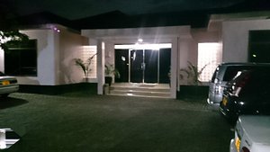 Transit Motel Airport in Dar es Salaam, image may contain: License Plate, Lighting, Car, Garage