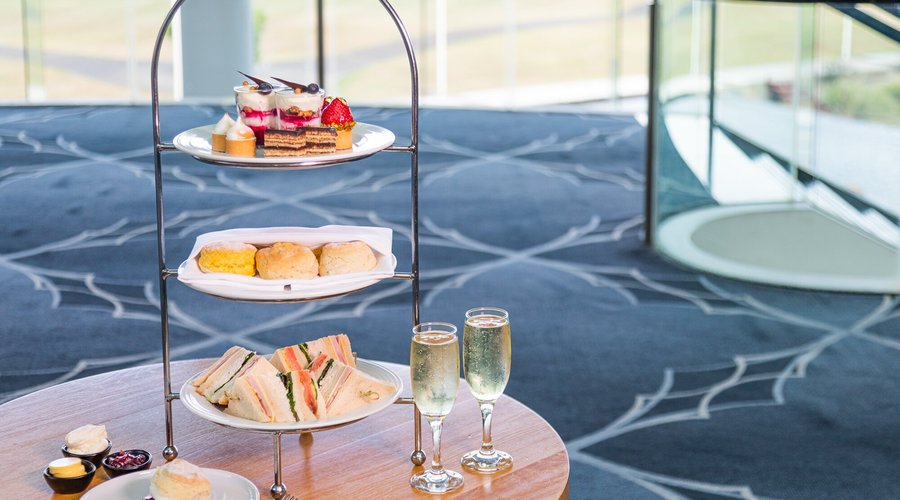 Panorama Lounge showcases an indulgent high tea of scones, sandwiches and sweets. 