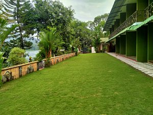 Elephant Pass Ayurveda & Yoga Retreat in Ernakulam, image may contain: Hotel, Resort, Villa, Grass