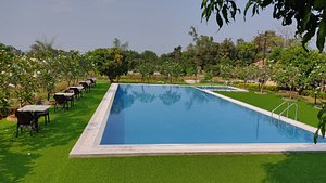 juSTa Rudra Resort & Spa in Durtoli, image may contain: Resort, Hotel, Pool, Swimming Pool