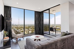 Meriton Suites Chatswood in Chatswood, image may contain: Penthouse, Living Room, Couch, Monitor
