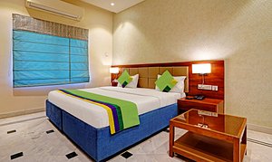 Treebo Trend Hotel YKS in Kota, image may contain: Interior Design, Furniture, Bed, Bedroom
