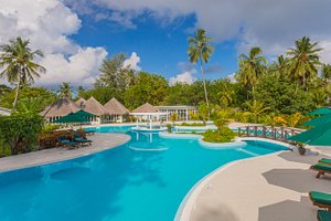 Equator Village Maldives in Gan Island, image may contain: Hotel, Resort, Pool, Outdoors