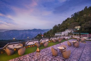 Pride Ashiyana Resort Mussoorie in Mussoorie, image may contain: Hotel, Resort, Terrace, Chair