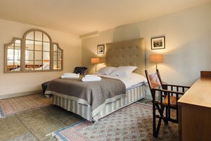 The White Swan Inn in Pickering, image may contain: Furniture, Home Decor, Dorm Room, Bedroom