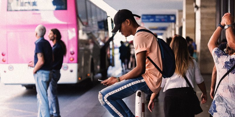A man waiting for the bus to Ciampino Airport from Termini in Rome.