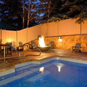 Outdoor Pool Zoomed In With Firepit Twilight