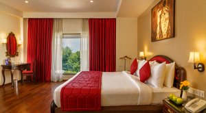 Fortune Pandiyan Hotel in Madurai, image may contain: Bed, Furniture, Interior Design, Home Decor