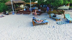 Casa Cabana Beach in Vilanculos, image may contain: Resort, Bench, Chair, Person