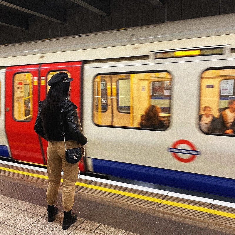 A woman waiting at the Tube station in London