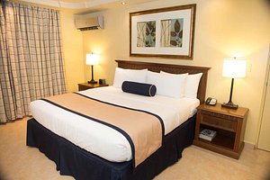 Best Western El Dorado Panama Hotel in Panama City, image may contain: Corner, Table Lamp, Lamp, Bed