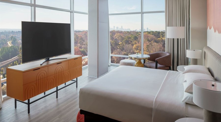 Buckhead Suite

Enjoy spectacular views of the Atlanta city skyline inside this spacious, 873-square-foot suite featuring one king bed in a separate bedroom, a luxe living room, vaulted ceilings, a sleeper sofa, and 180-degree floor-to-ceiling windows filling the space with natural light. 