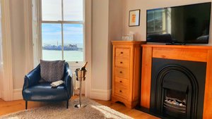 A Room With A View in Brighton, image may contain: Monitor, Screen, Computer Hardware, TV