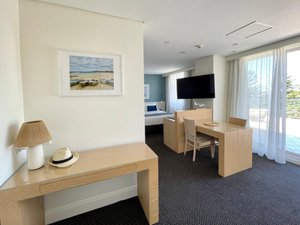 Coogee Sands Hotel & Apartments in Coogee, image may contain: Table, Table Lamp, Monitor, Screen
