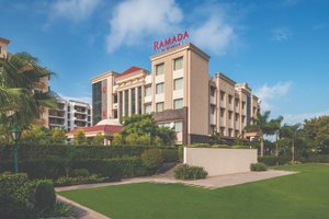 Ramada by Wyndham Varanasi Katesar in Varanasi, image may contain: Hotel, Resort, Grass, Neighborhood