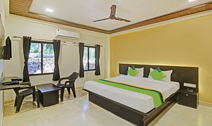 Treebo Trend Raaya Regency in Mahabaleshwar, image may contain: Ceiling Fan, Electrical Device, Device, Furniture