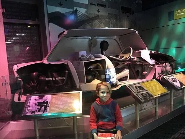 must visit places with family Child in front of exhibit