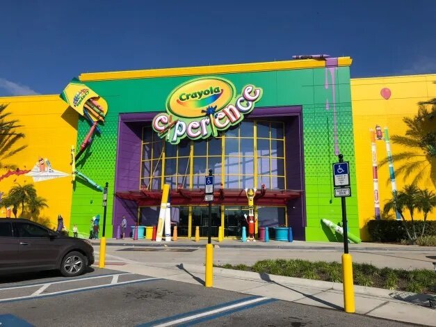 Bright yellow and green exterior with fake crayon box 