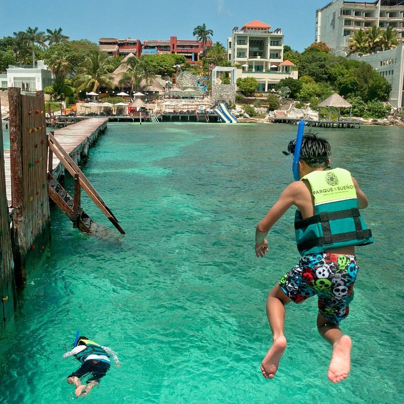 Boys jumping into the waters at Isla Mujeres in Cancun