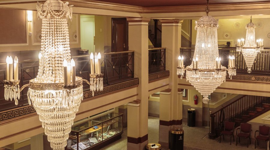 These "wedding cake" chandeliers are original to the building, built in 1926 as a historic movie palace.