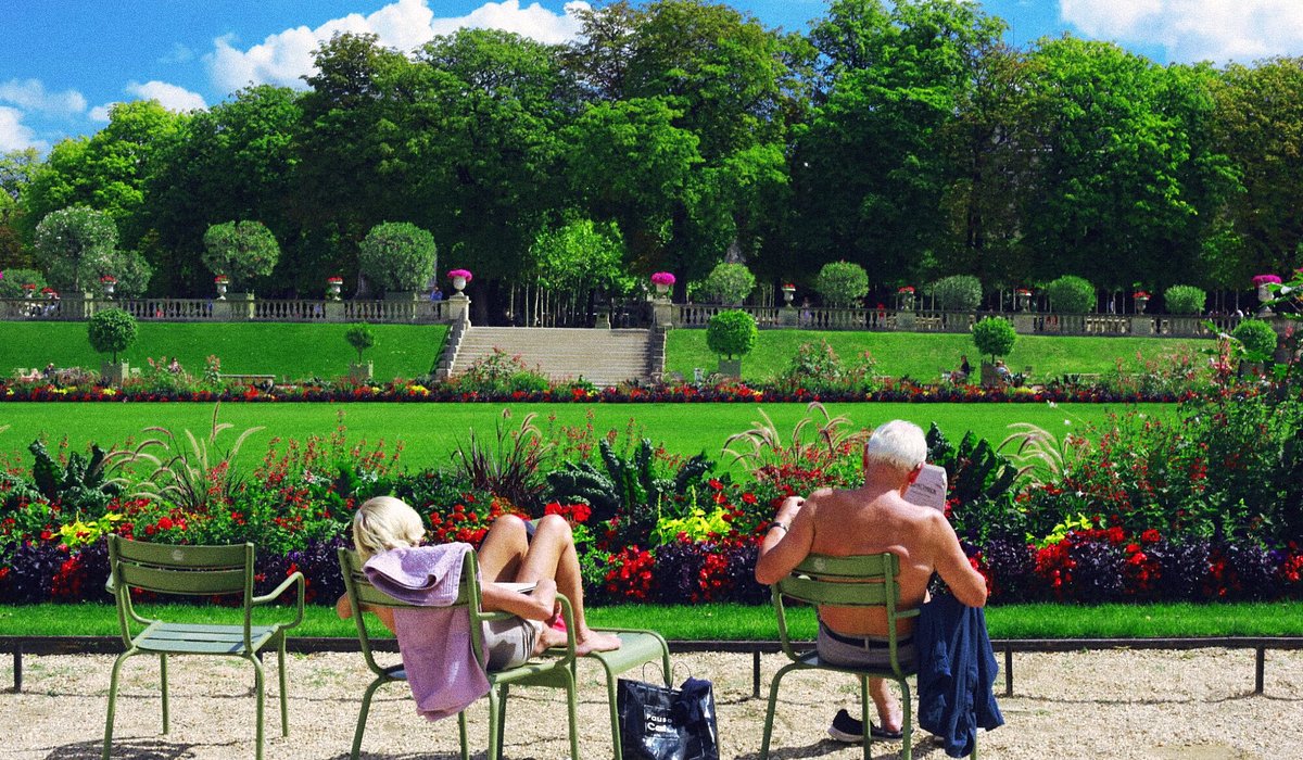 A couple relaxing at Jardin du Luxembourg