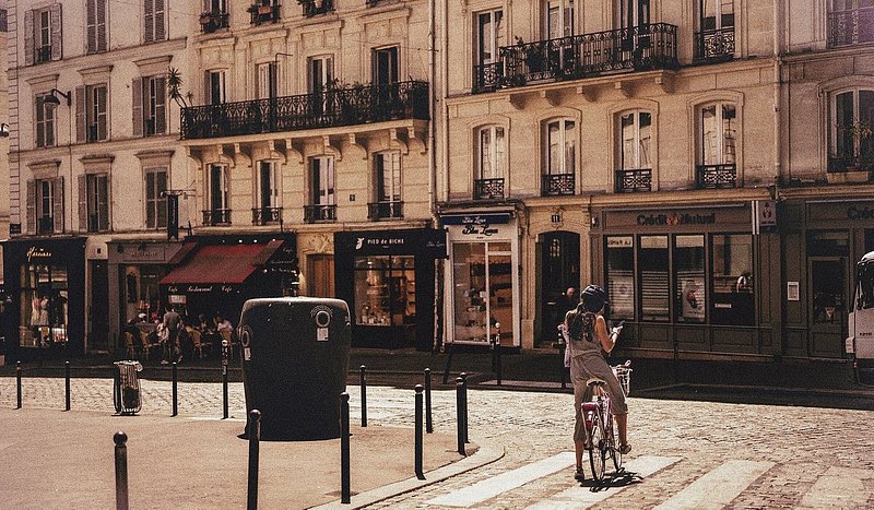 A woman cycling around Paris
