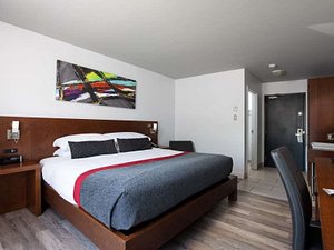 Hotel V in Gatineau, image may contain: Interior Design, Bed, Furniture, Bedroom