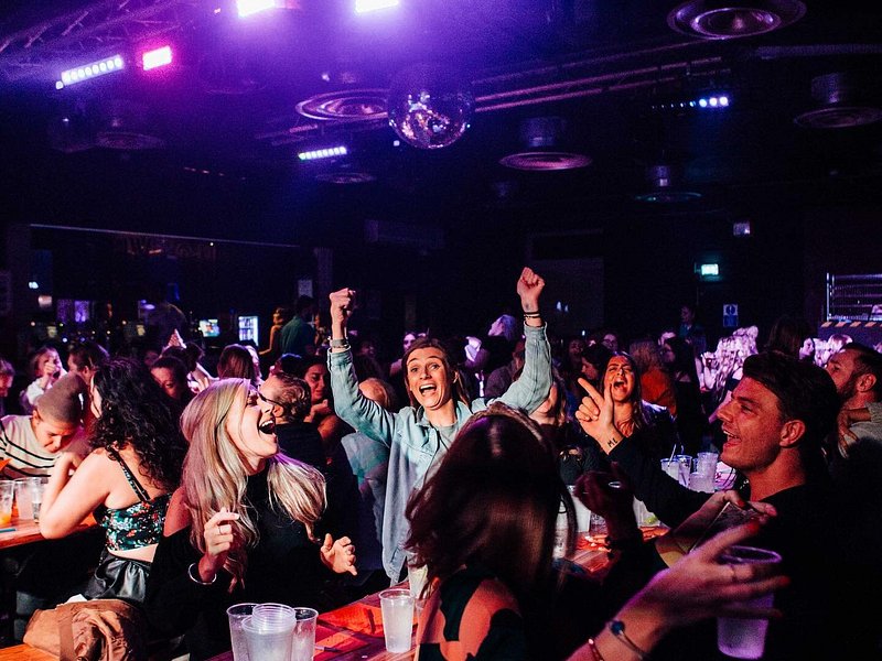 A group of people playing drag bingo at Brixton Jamm in London