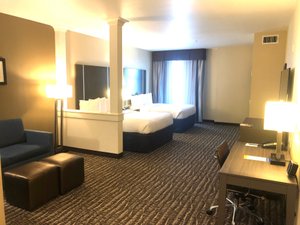 Comfort Suites Northwest Houston At Beltway 8 in Houston, image may contain: Home Decor, Furniture, Bed, Chair