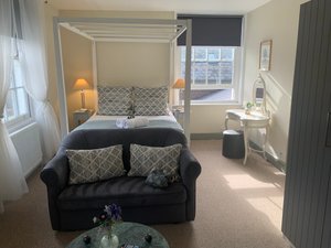 The Blue Pigeons in Worth, image may contain: Couch, Furniture, Bedroom, Indoors