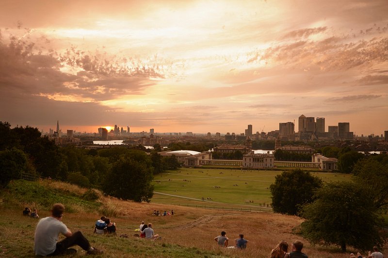 People watching sunset at Greenwich Park, London, England