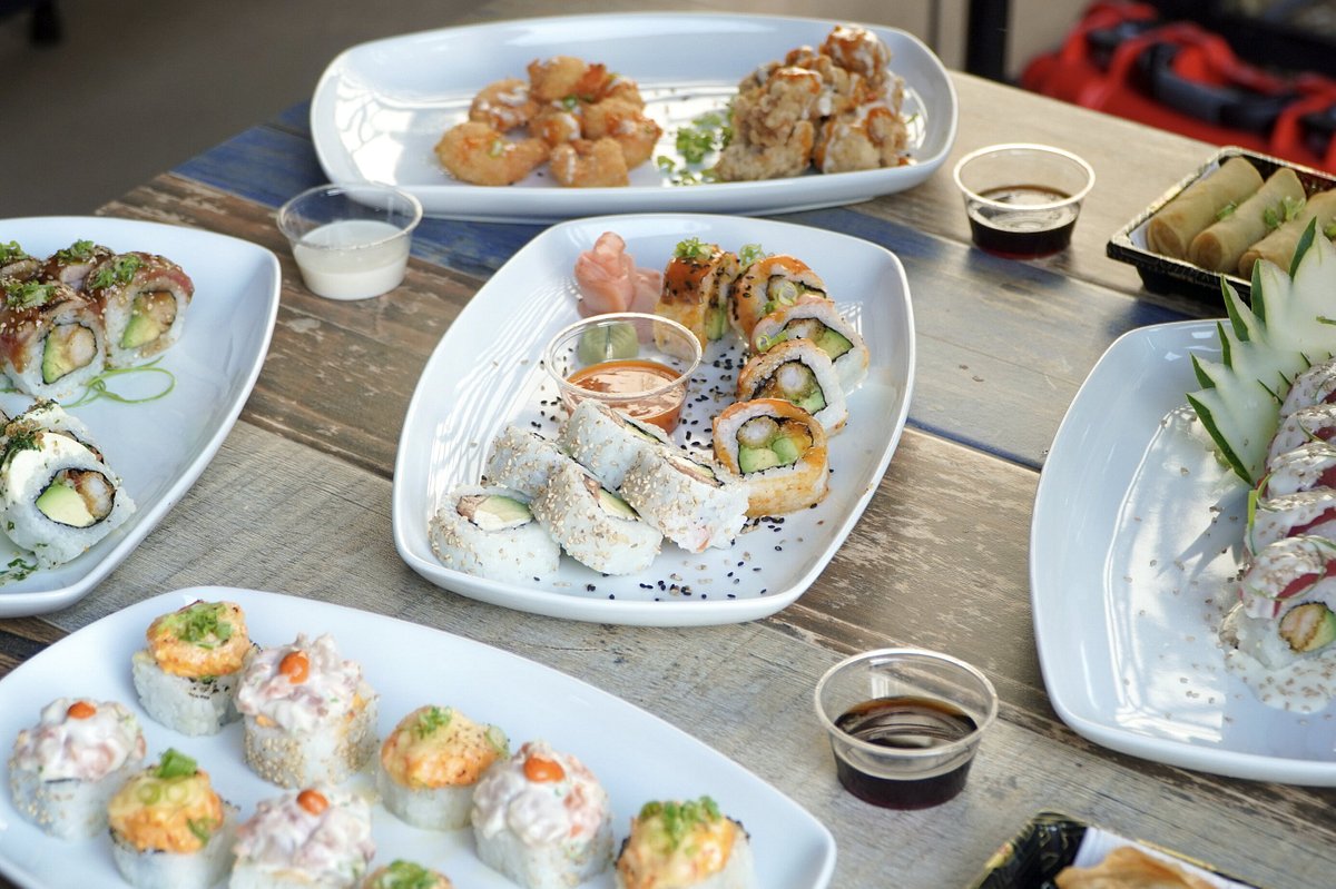 https://dynamic-media-cdn.tripadvisor.com/media/photo-o/22/c3/74/15/a-table-full-os-sushi.jpg?w=1200&h=-1&s=1