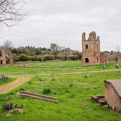 People walking along the Via Appia Antica in Rome