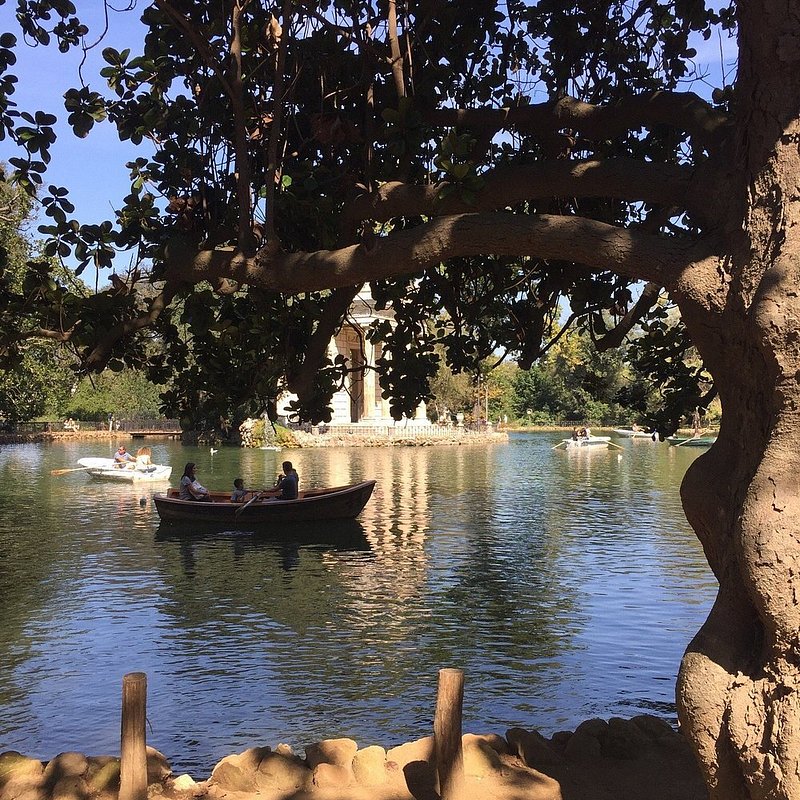 Boats paddling on the lake at Villa Borghese in Rome